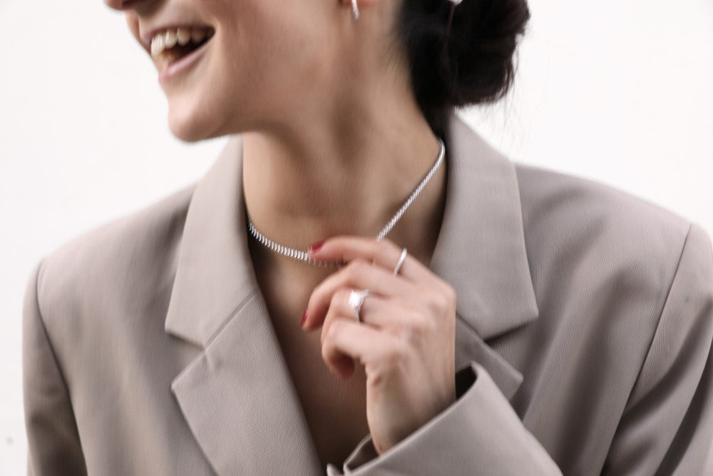 happy woman wearing diamond jewellery
