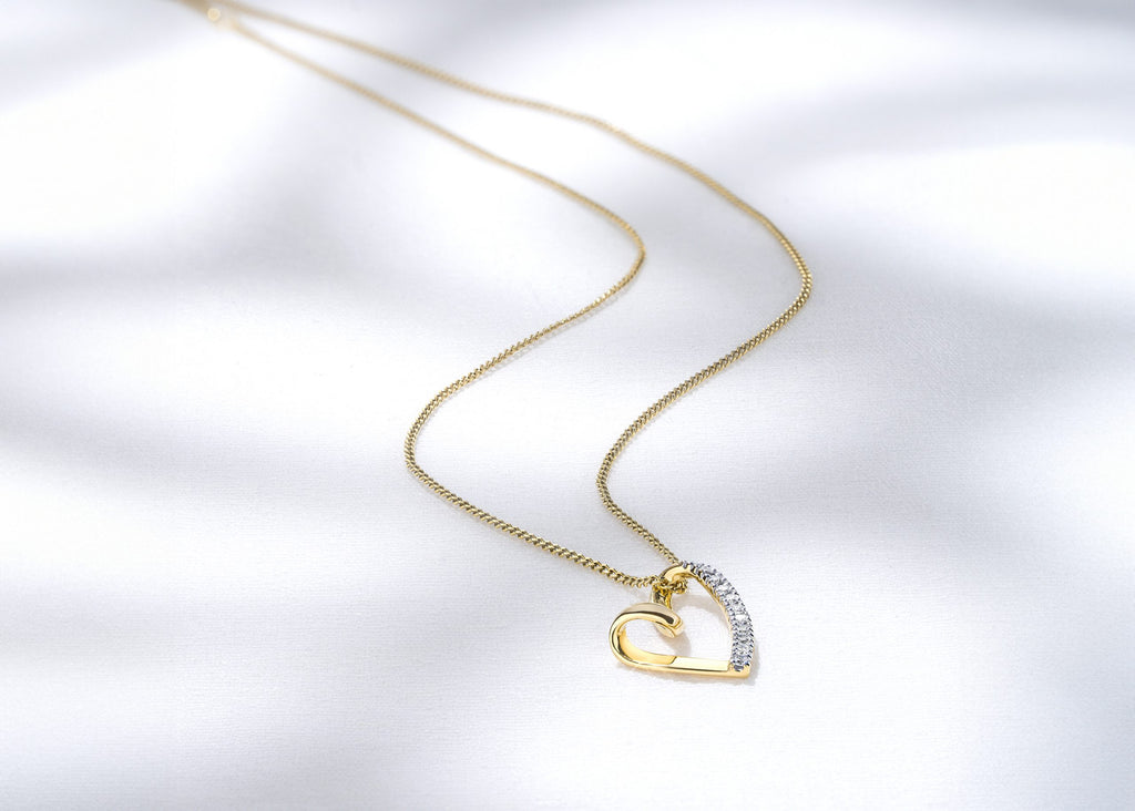 diamond heart pendant in yellow gold necklace