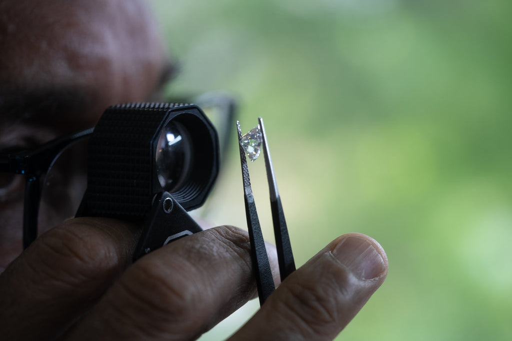 jeweller studying diamond