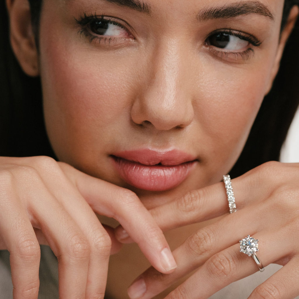 woman with diamond rings