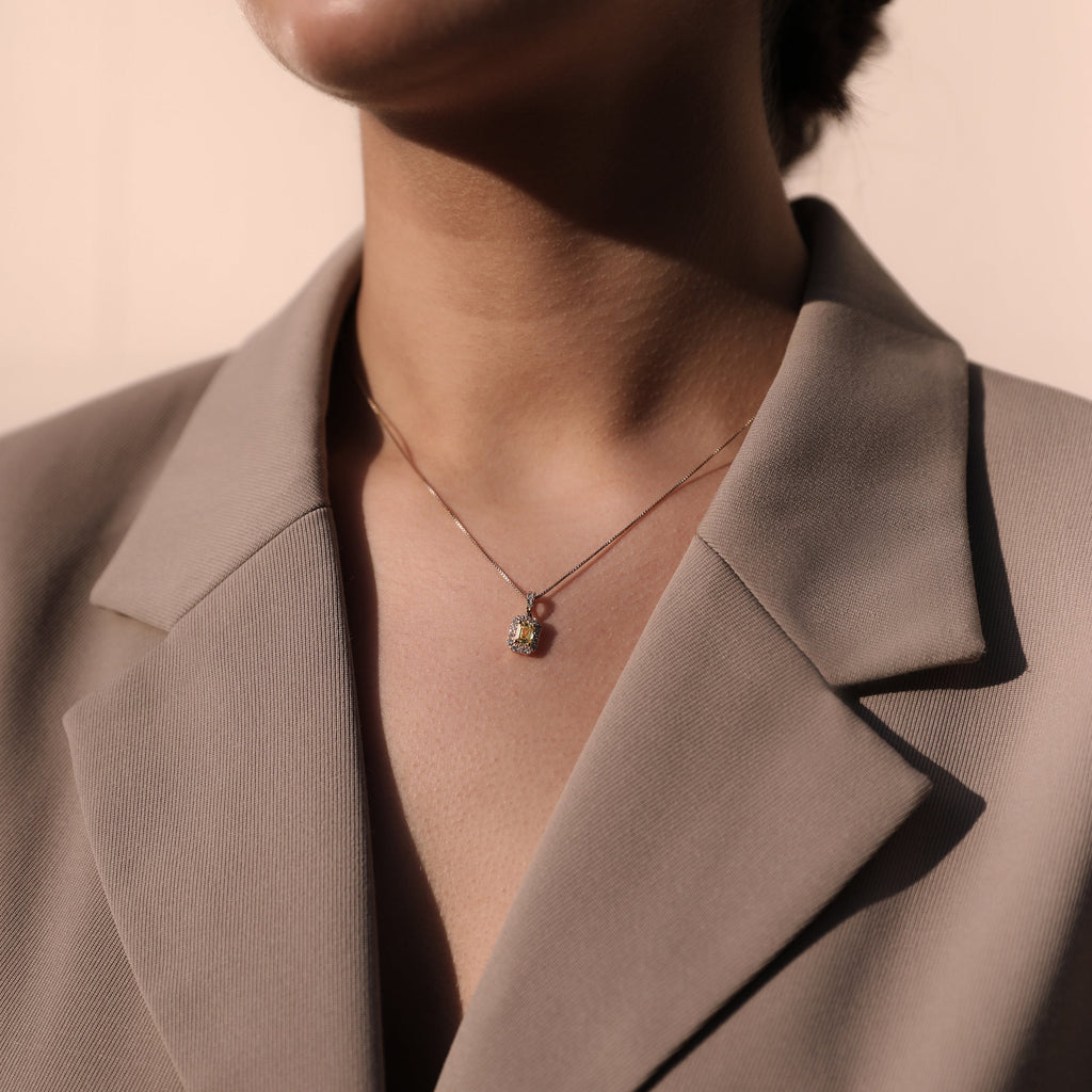 smart woman wearing drop pendant necklace