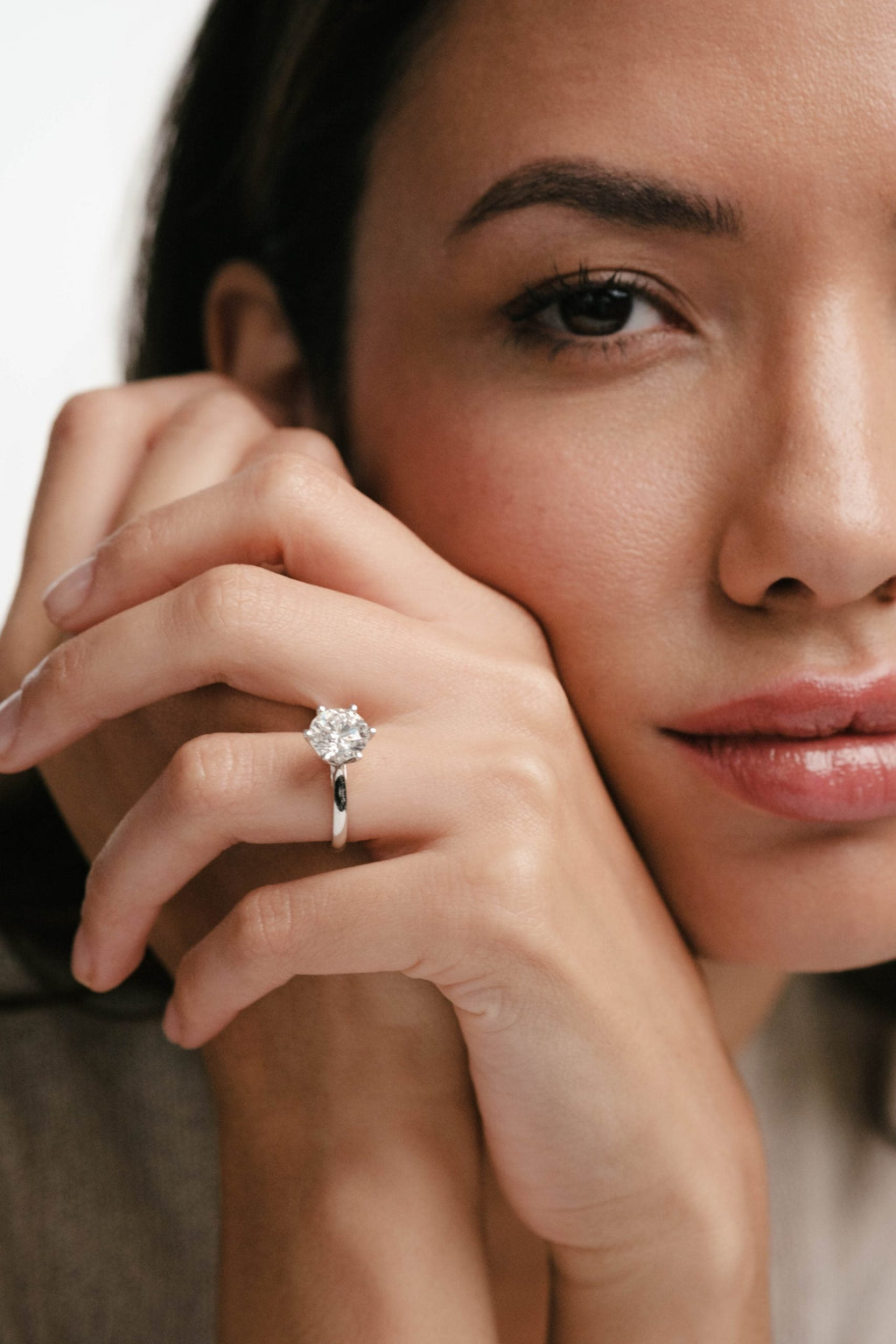 woman wearing diamond engagement ring