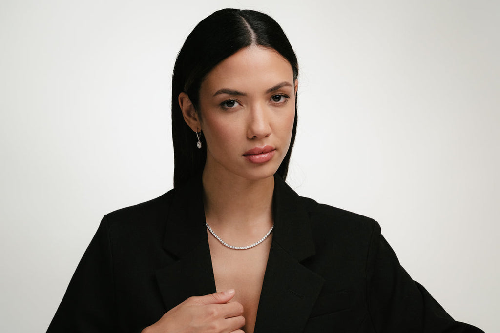 lady in black blazer wearing jewellery