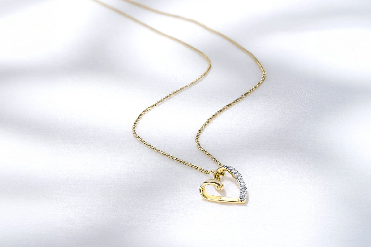 diamond heart pendant in yellow gold necklace