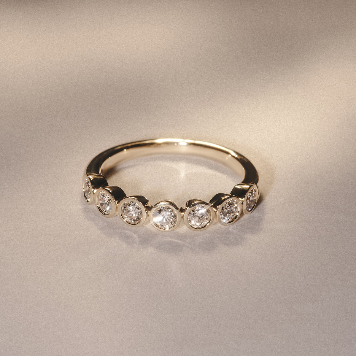 Orbit Half Band 0.30ct G/VS Round Cut Rubover Eternity Ring in 9K Yellow Gold