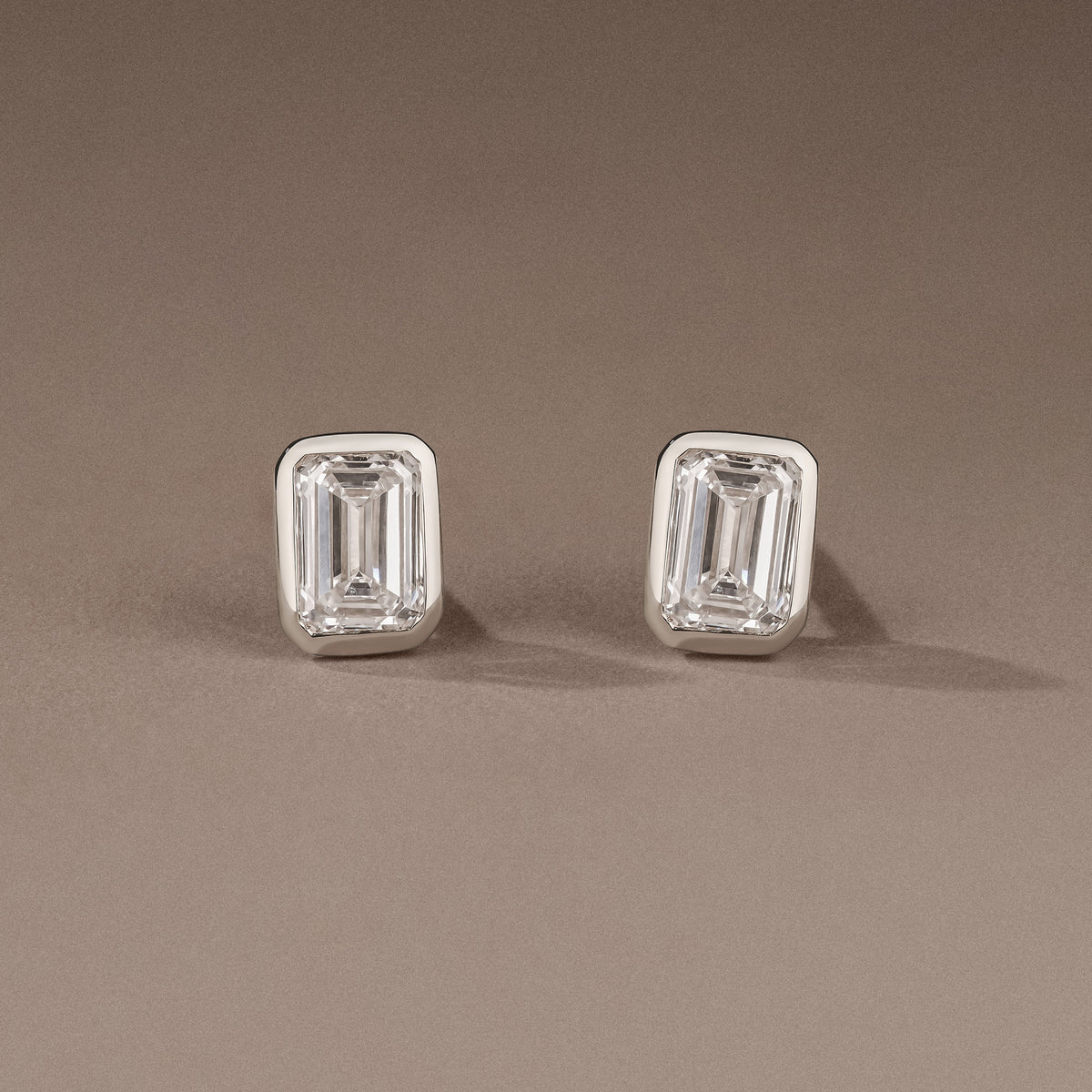 Bezel Set 1.00ct Emerald Cut Lab Diamond Stud Earrings in 18K White Gold