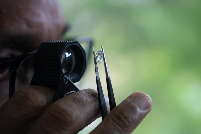 jeweller studying diamond