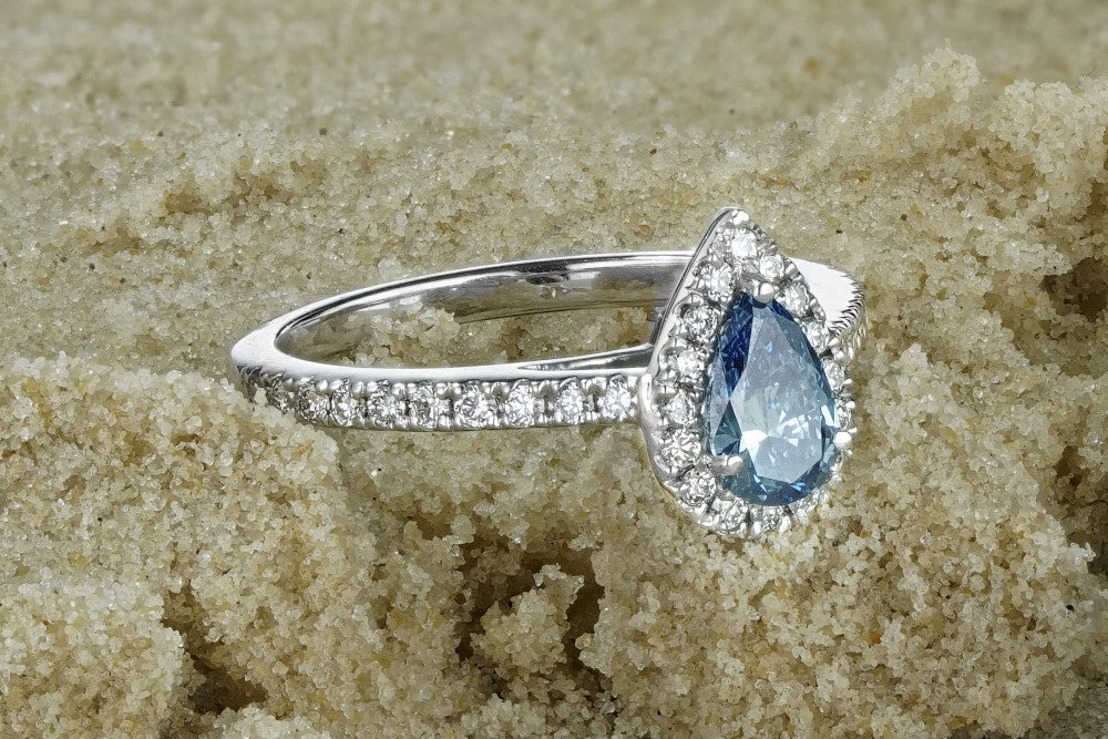 Blue lab diamond pear cut halo engagement ring