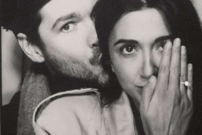 Couple showing engagement ring
