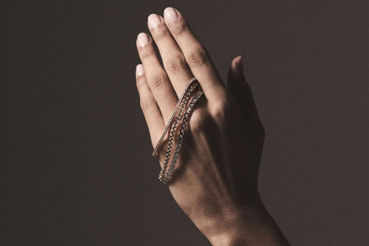 hand showing tennis bracelets