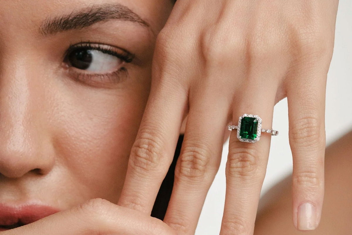 woman wearing a gemstone engagement ring
