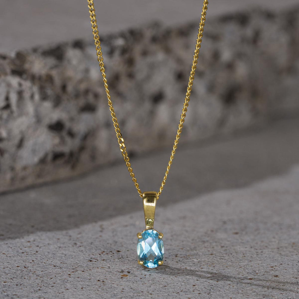Blue Topaz 7 x 5mm 9K Yellow Gold Pendant Necklace
