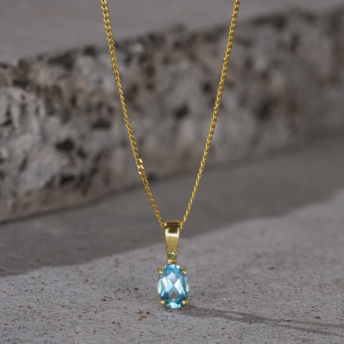 Blue Topaz 7 x 5mm 9K Yellow Gold Pendant Necklace