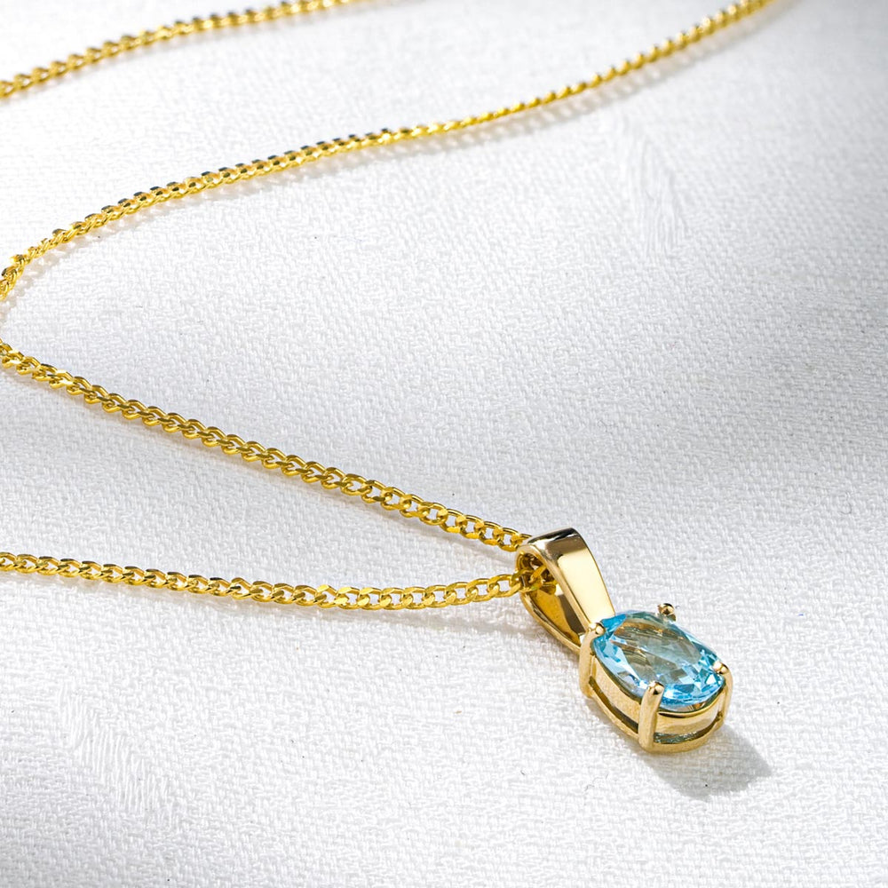Blue Topaz 7 x 5mm 9K Yellow Gold Pendant Necklace