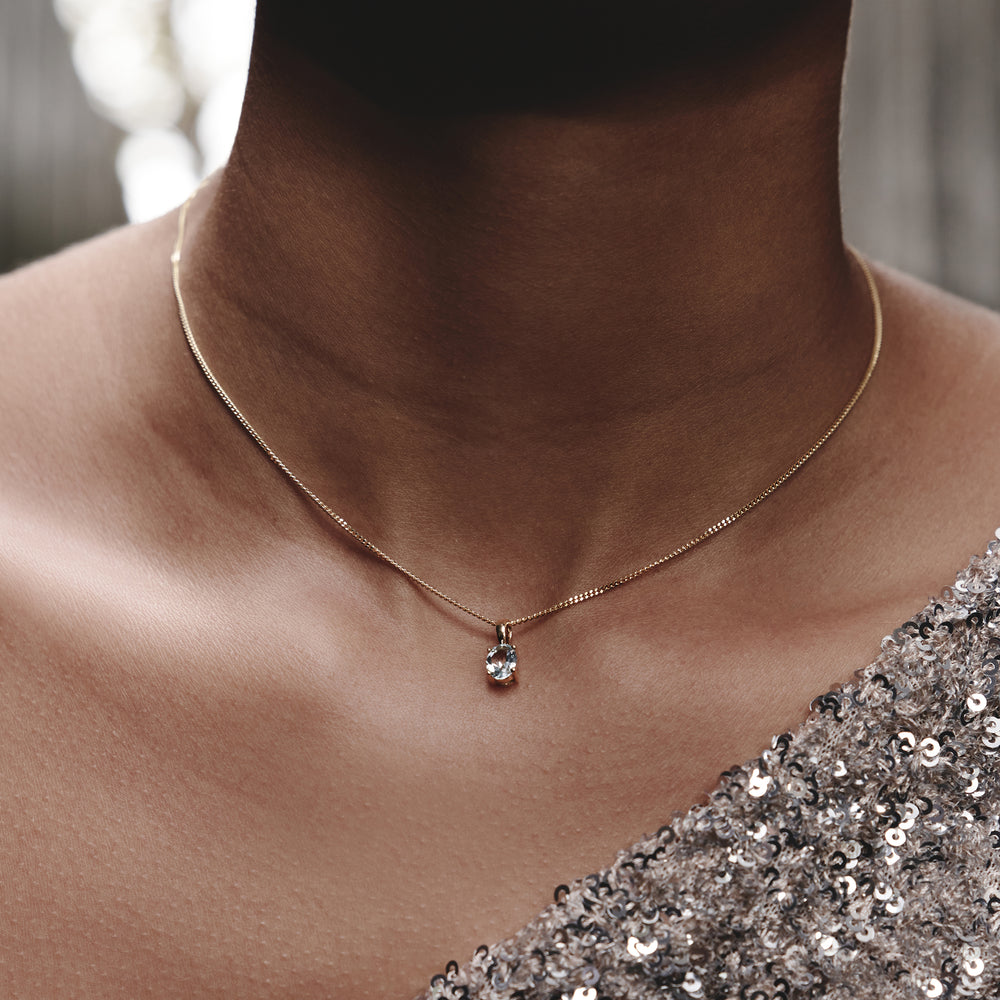 Blue Topaz 7 x 5mm 9K Yellow Gold Pendant Necklace