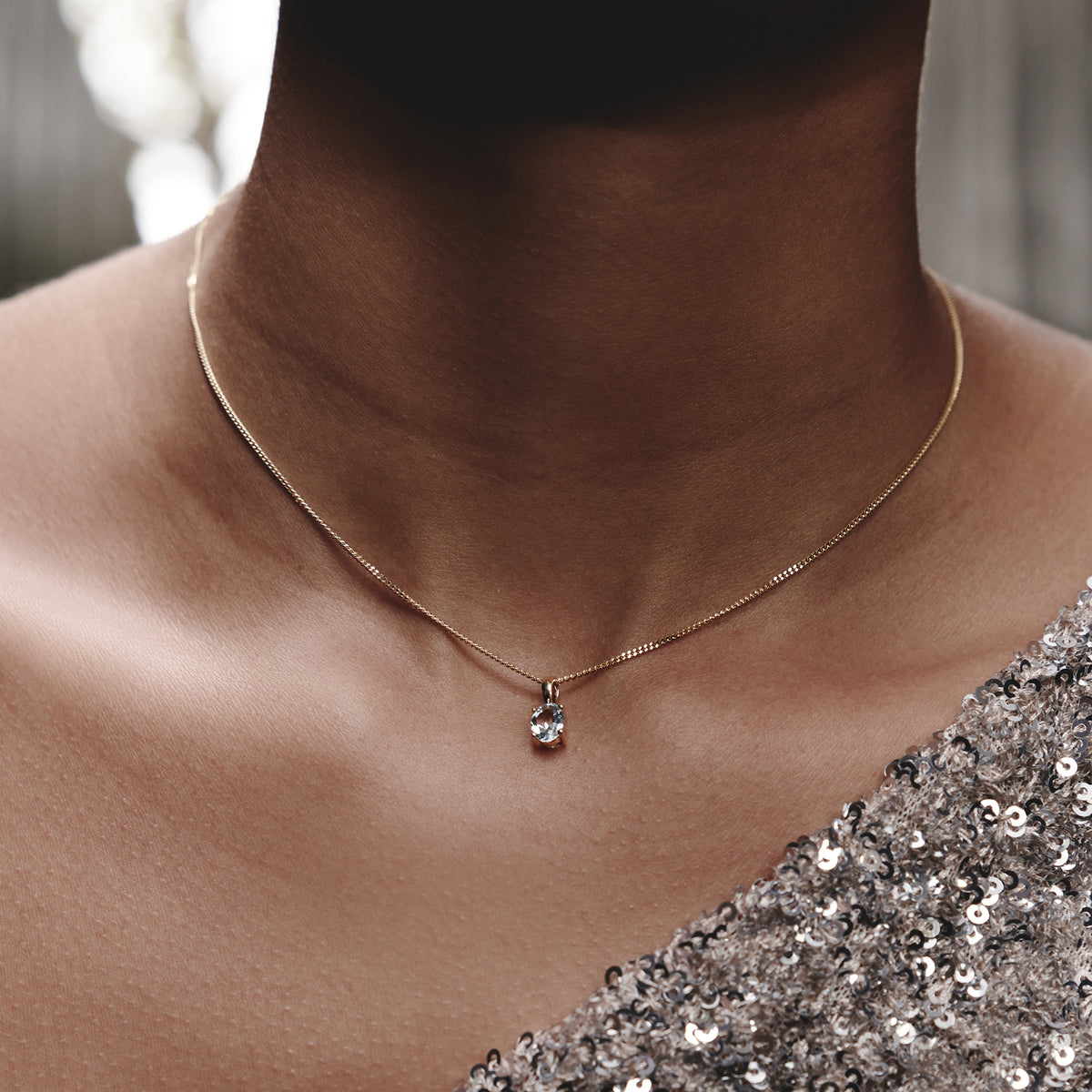 Blue Topaz 7 x 5mm 9K Yellow Gold Pendant Necklace