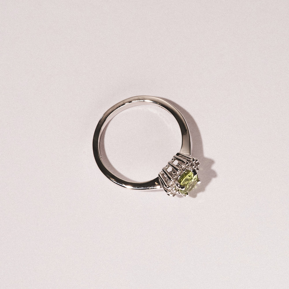 Peridot 7 x 5mm And Diamond 9K White Gold Ring