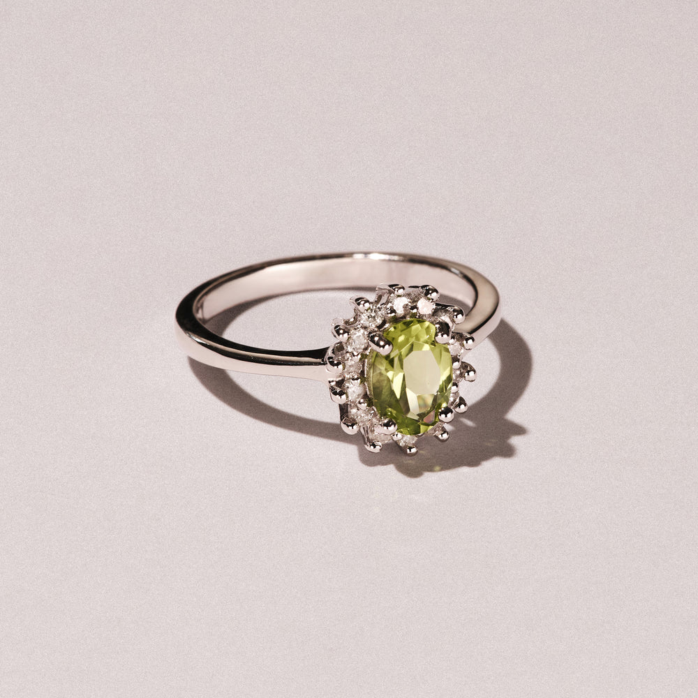 Peridot 7 x 5mm And Diamond 9K White Gold Ring