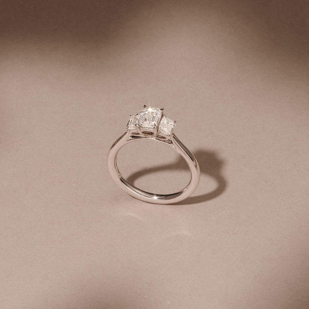 Evoke 1.00ct Emerald Cut Lab Diamond 3 Stone Ring in 9K White Gold