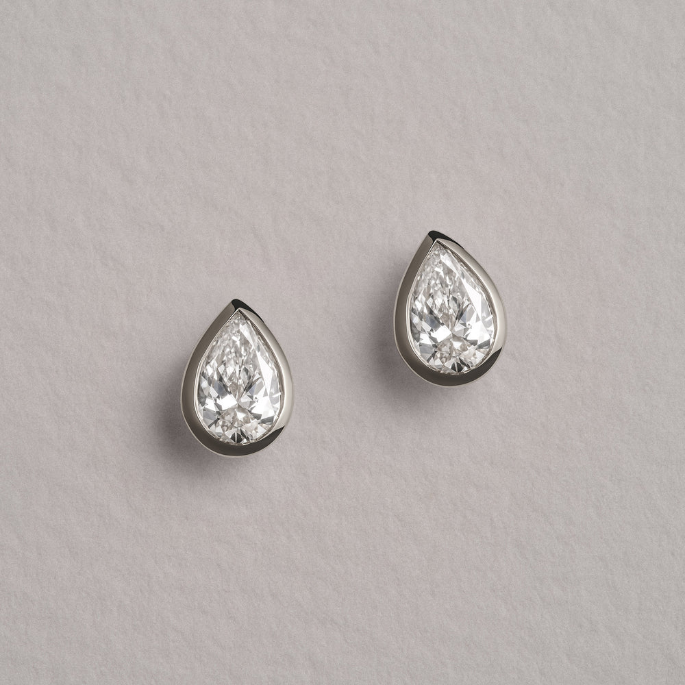 Bezel Set 1.00ct Pear Cut Lab Diamond Stud Earrings in Platinum