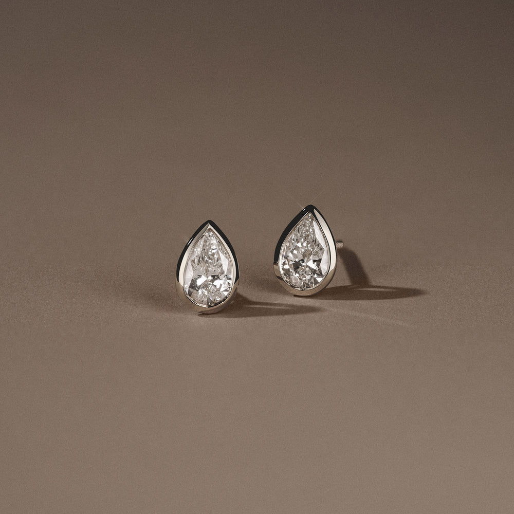 Bezel Set 1.00ct Pear Cut Lab Diamond Stud Earrings in Platinum