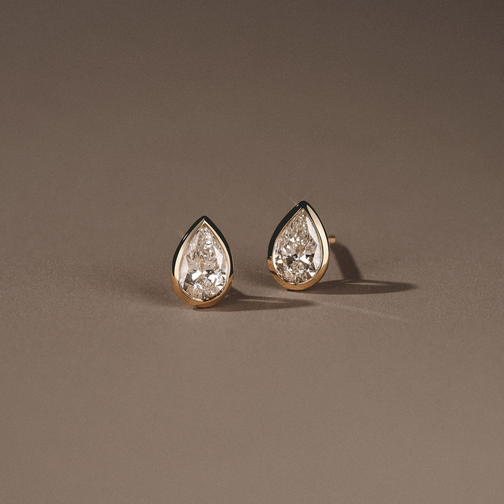 Bezel Set 1.00ct Pear Cut Lab Diamond Stud Earrings in 18K Yellow Gold