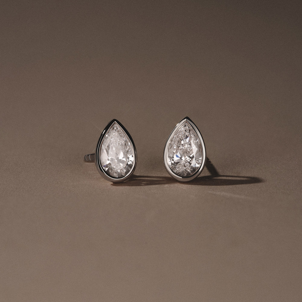 Bezel Set 2.00ct Pear Cut Lab Diamond Stud Earrings in Platinum
