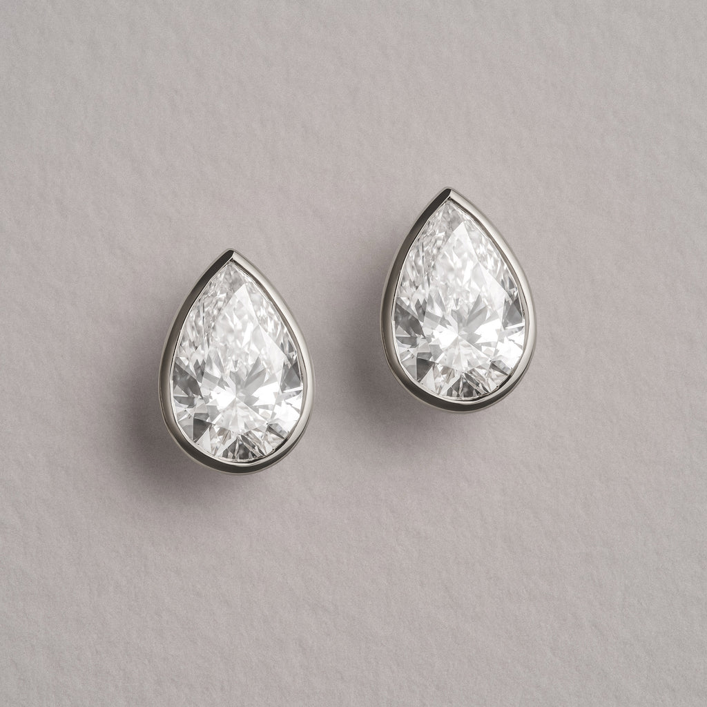 Bezel Set 3.00ct Pear Cut Lab Diamond Stud Earrings in Platinum