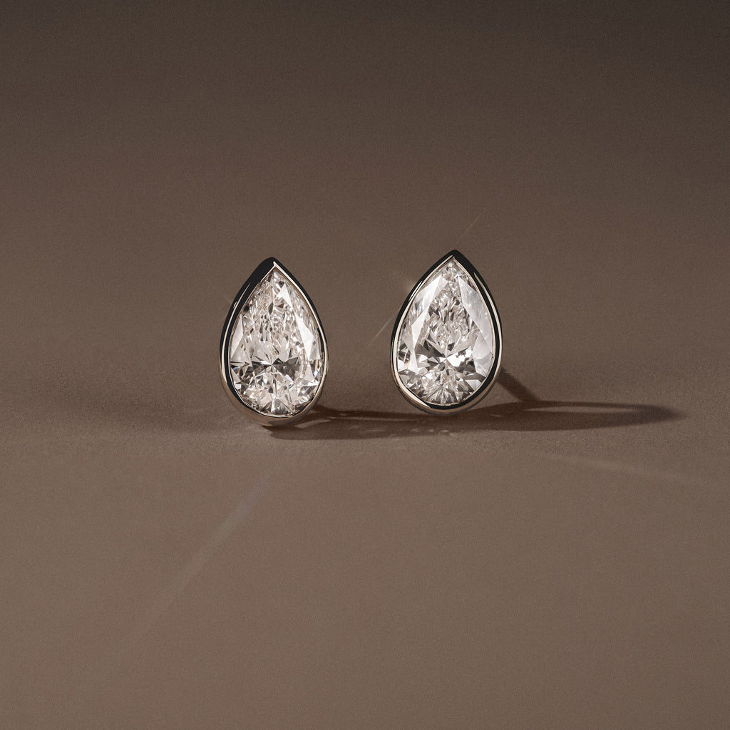 Bezel Set 3.00ct Pear Cut Lab Diamond Stud Earrings in Platinum