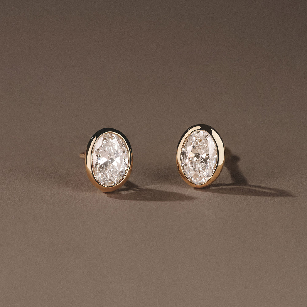 Bezel Set 1.00ct Oval Cut Lab Diamond Stud Earrings in 18K Yellow Gold