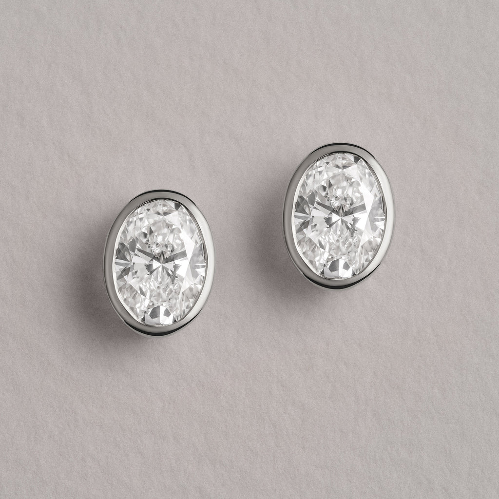 Skyline Bezel Set 2.00ct Oval Cut Lab Diamond Stud Earrings in 18K White Gold