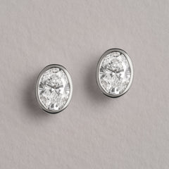 Skyline Bezel Set 2.00ct Oval Cut Lab Diamond Stud Earrings in 18K White Gold
