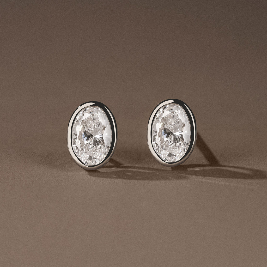 Skyline Bezel Set 2.00ct Oval Cut Lab Diamond Stud Earrings in 18K White Gold