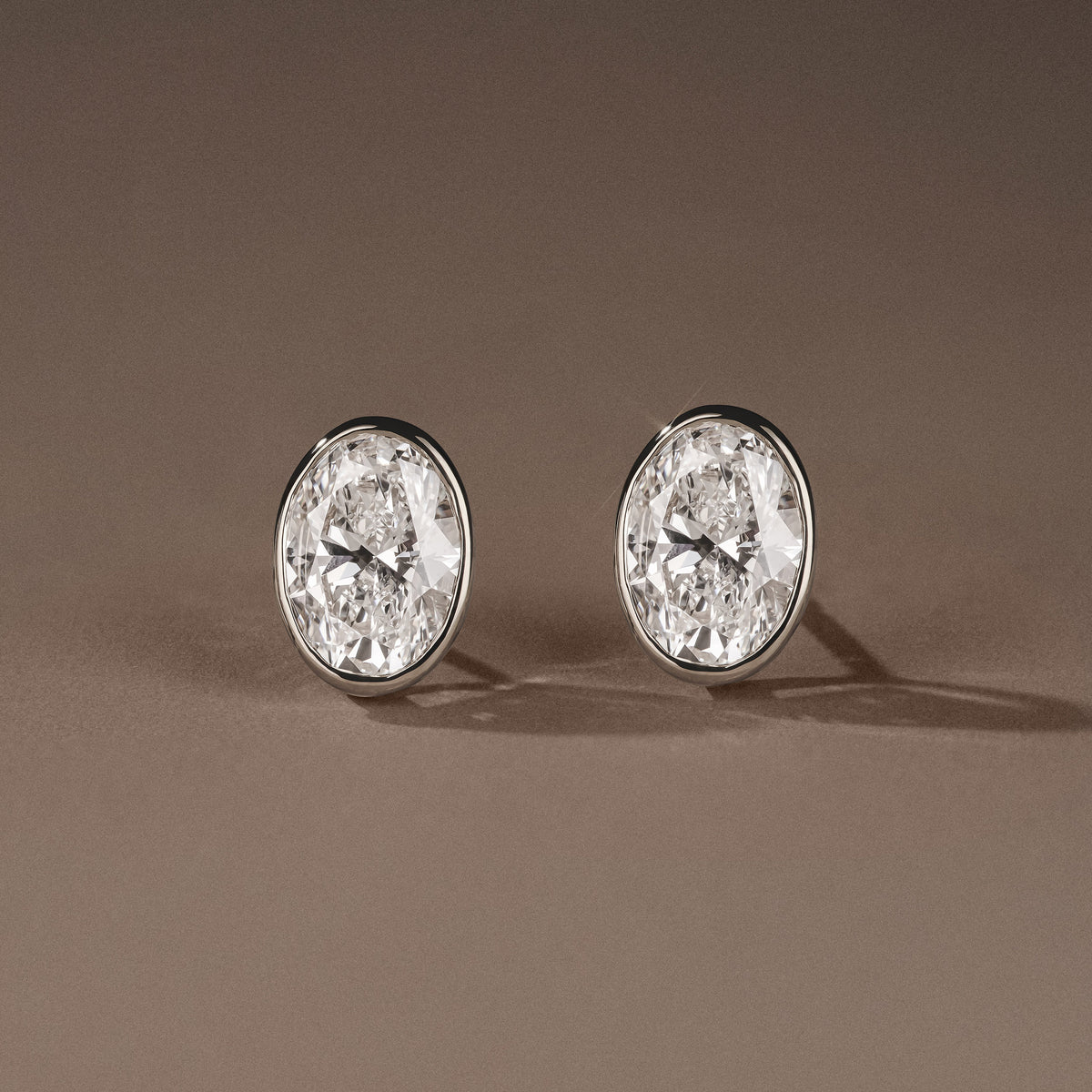 Bezel Set 3.00ct Oval Cut Lab Diamond Stud Earrings in Platinum