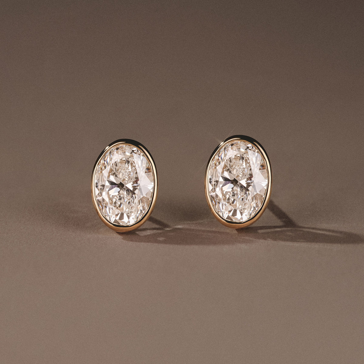 Bezel Set 3.00ct Oval Cut Lab Diamond Stud Earrings in 18K Yellow Gold