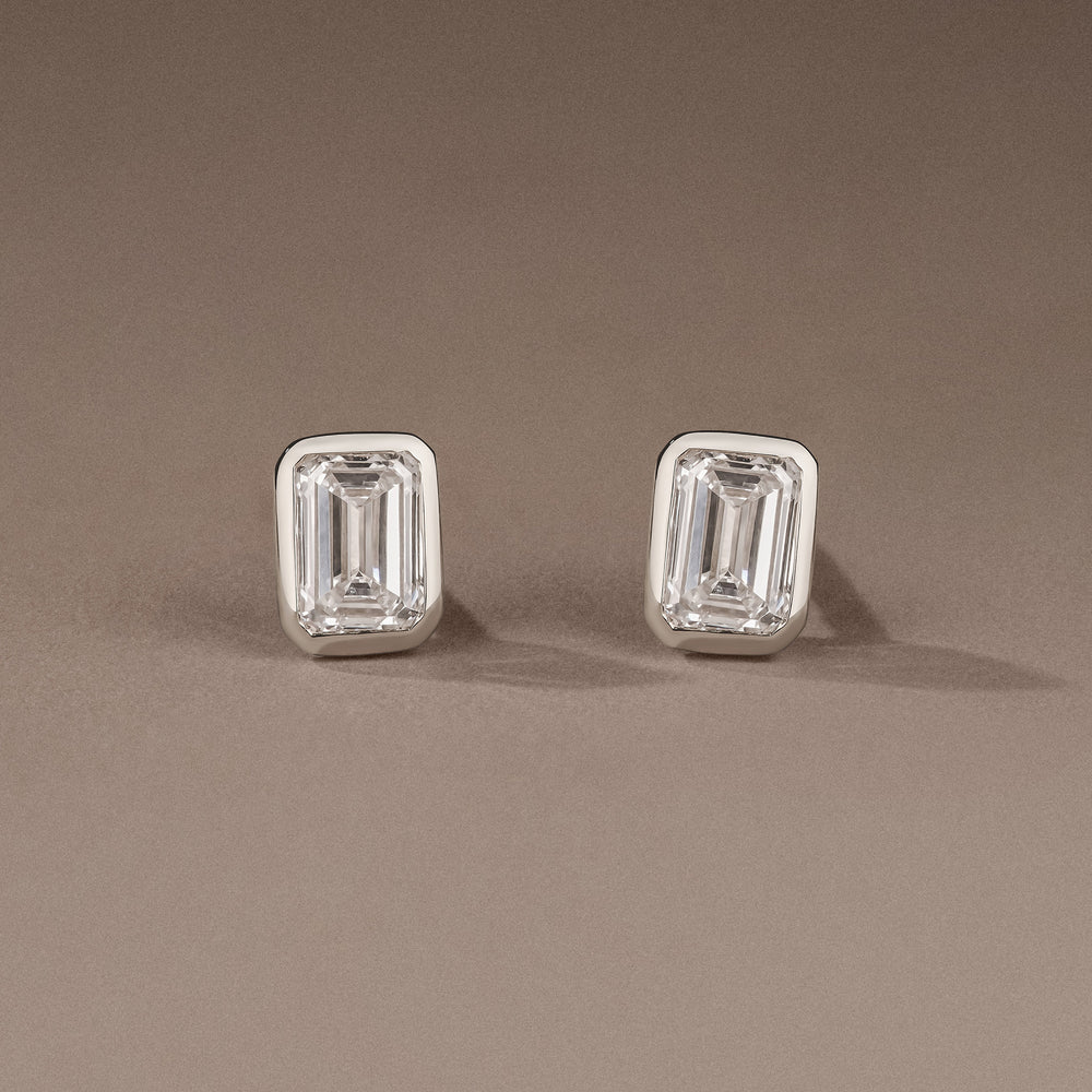 Bezel Set 1.00ct Emerald Cut Lab Diamond Stud Earrings in 18K White Gold
