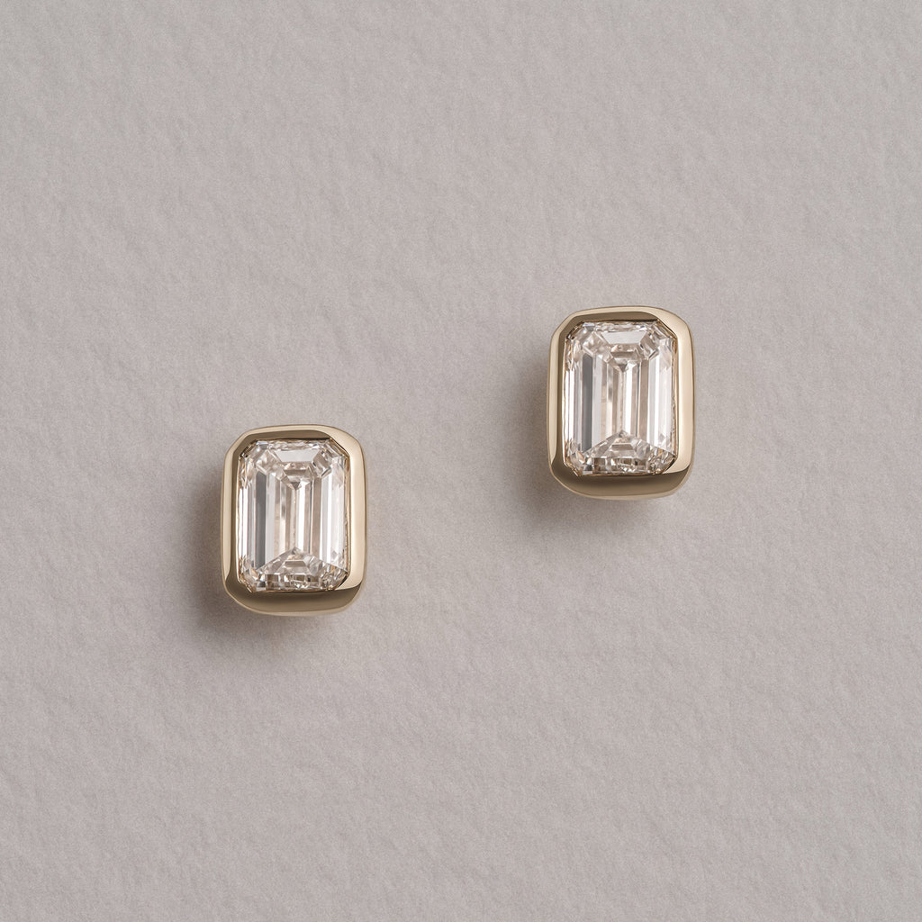 Skyline Bezel Set 1.00ct Emerald Cut Lab Diamond Stud Earrings in 18K Yellow Gold