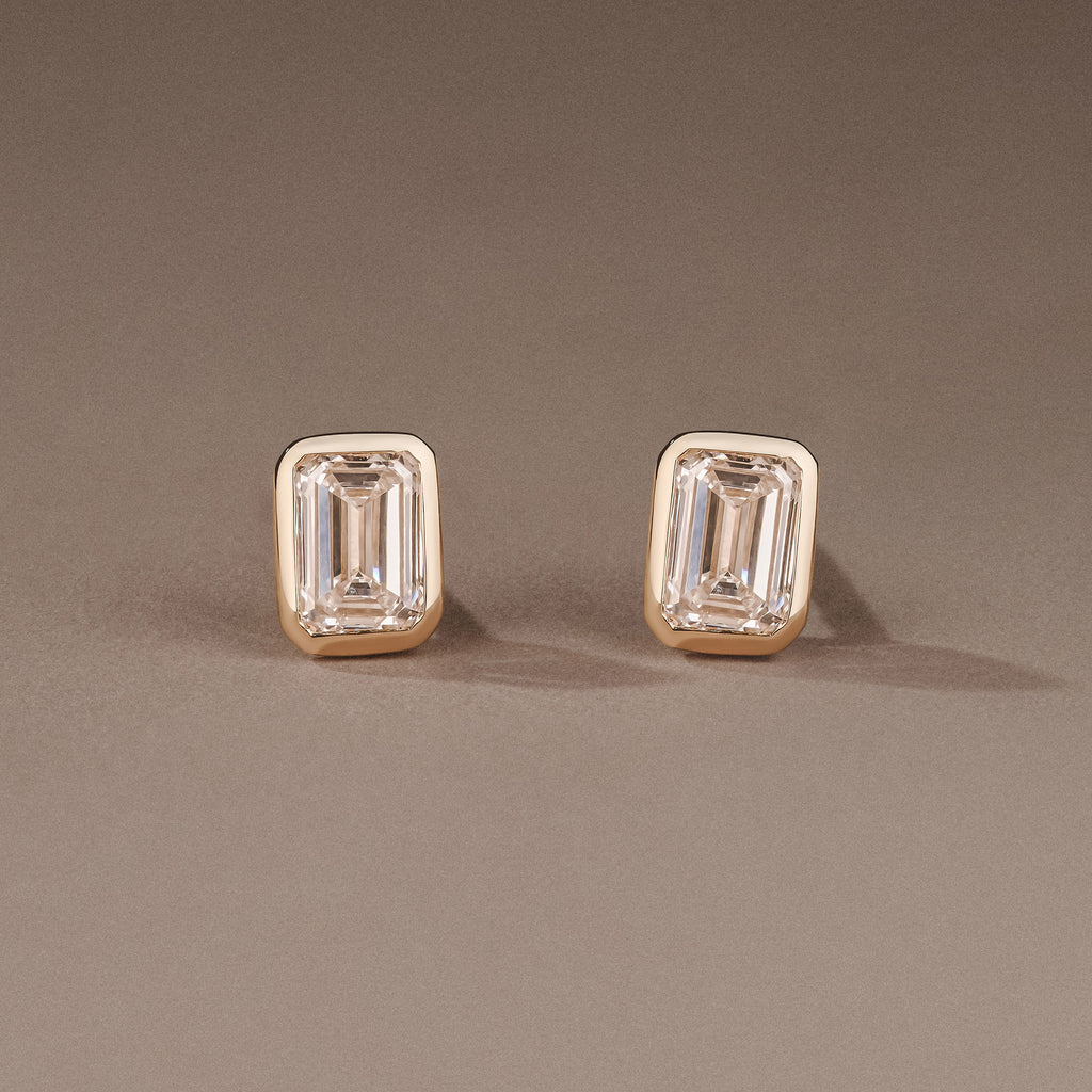 Skyline Bezel Set 1.00ct Emerald Cut Lab Diamond Stud Earrings in 18K Yellow Gold