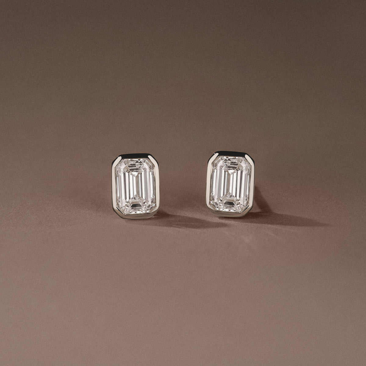 Bezel Set 2.00ct Emerald Cut Lab Diamond Stud Earrings in 18K White Gold