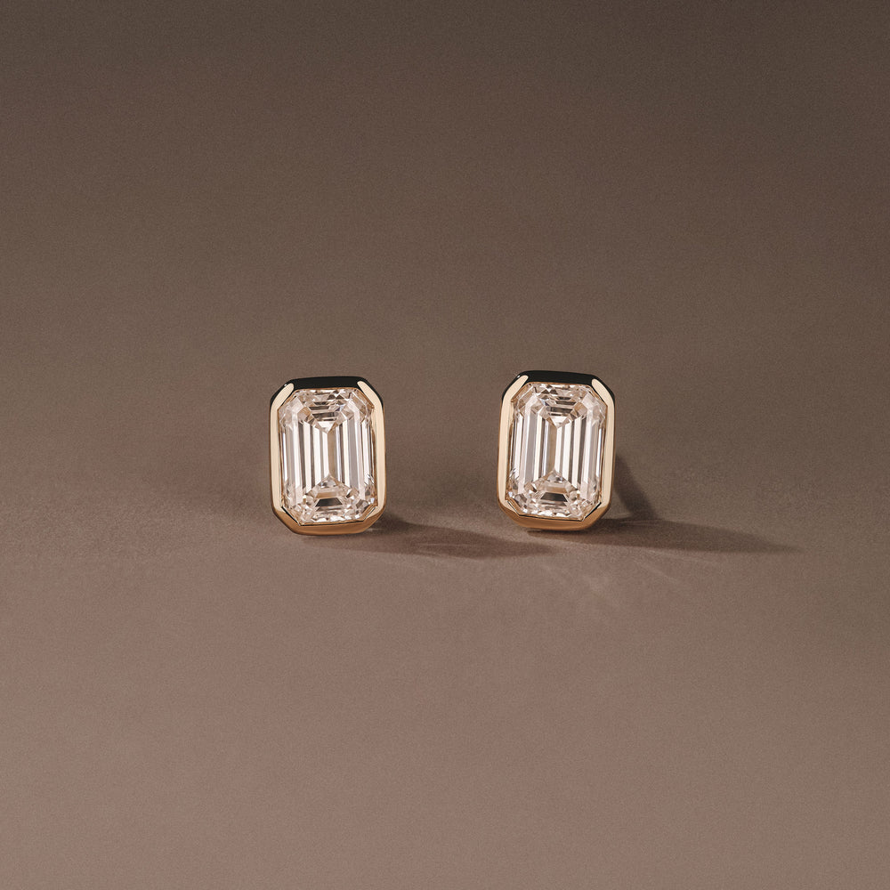 Bezel Set 2.00ct Emerald Cut Lab Diamond Stud Earrings in 18K Yellow Gold