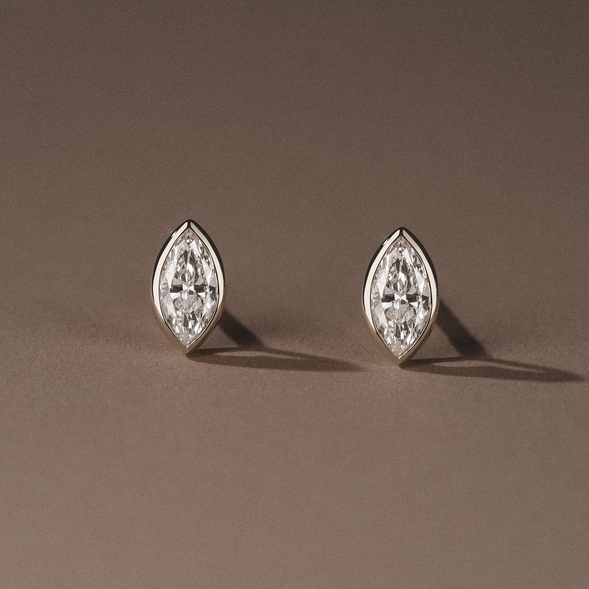 Bezel Set 0.50ct Marquise Cut Lab Diamond Stud Earrings in Platinum