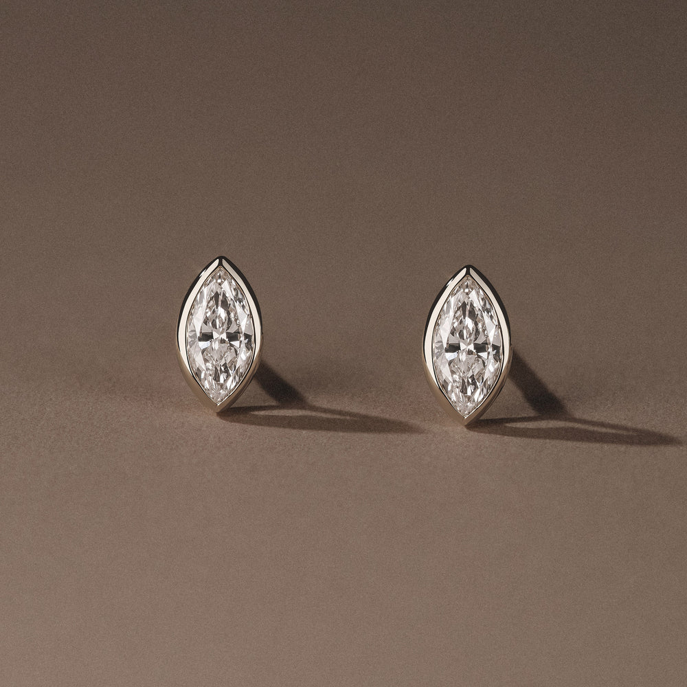 Bezel Set 0.50ct Marquise Cut Lab Diamond Stud Earrings in 18K White Gold
