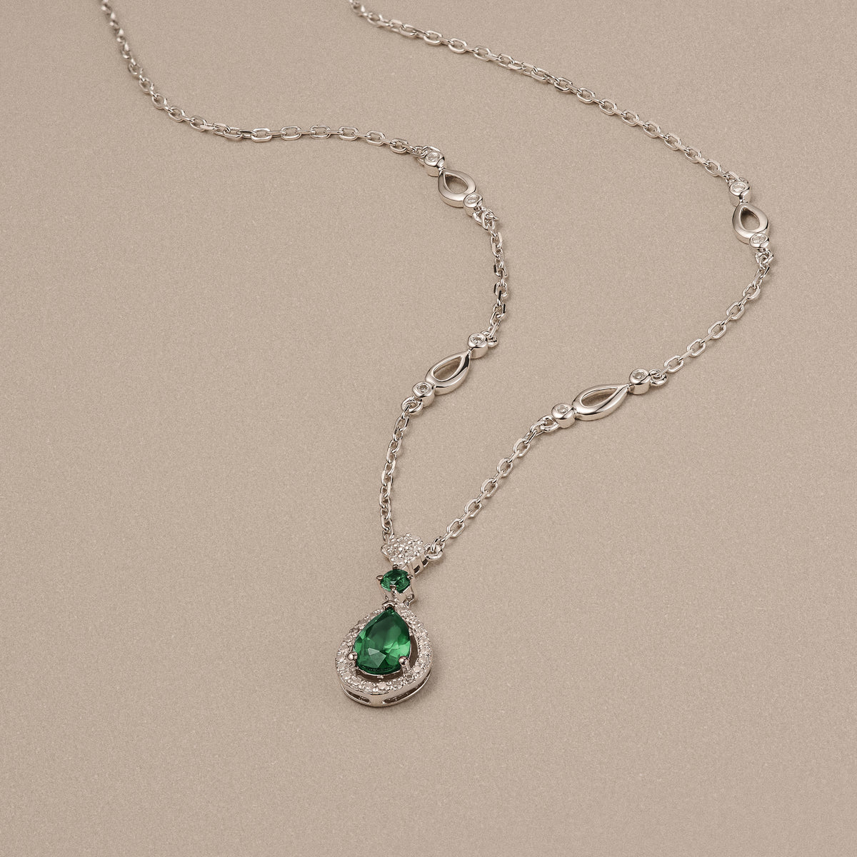 Stellato 0.33ct Pear Cut Lab Emerald Halo Pendant Necklace in Sterling Silver