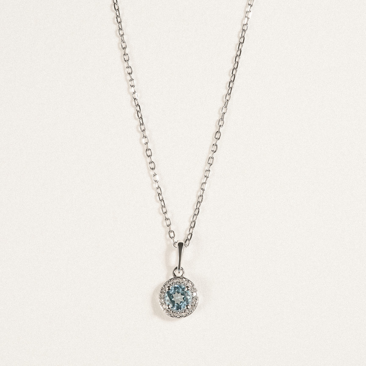 Stellato 0.40ct Round Cut Blue Topaz and Lab Diamond Halo Pendant Necklace in Sterling Silver