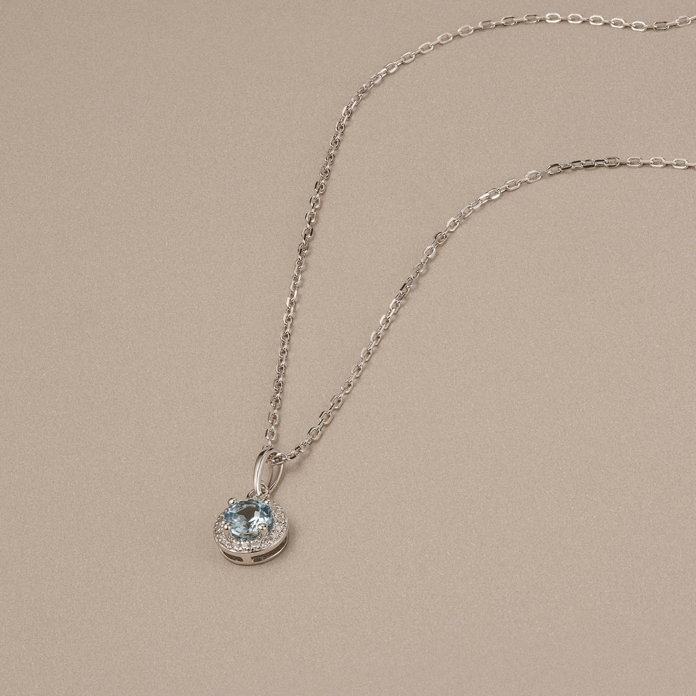 Stellato 0.40ct Round Cut Blue Topaz and Lab Diamond Halo Pendant Necklace in Sterling Silver