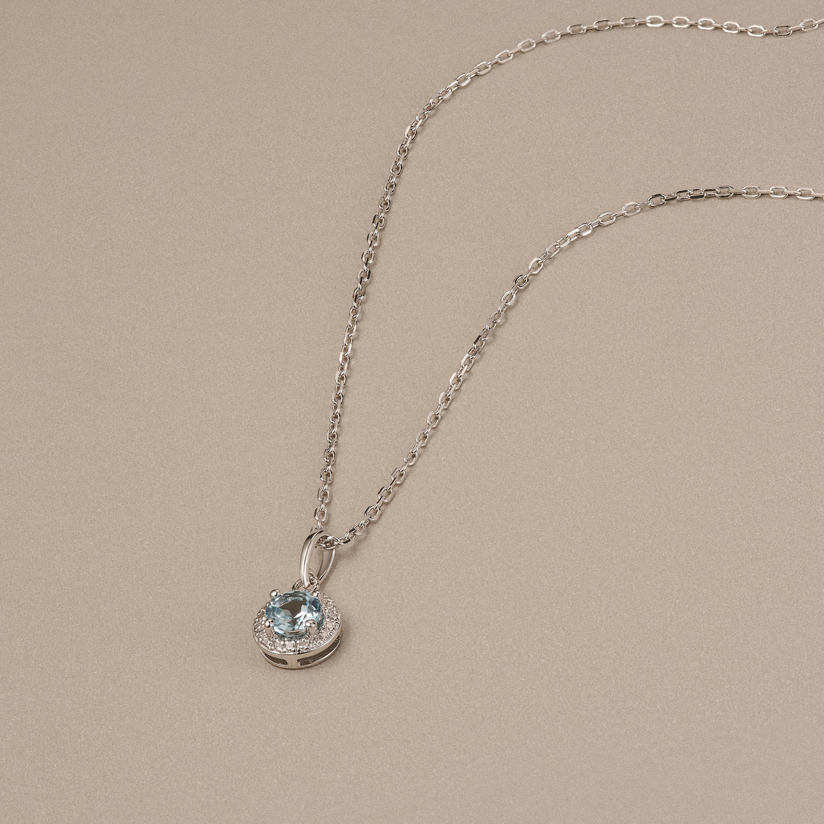 Stellato 0.40ct Round Cut Blue Topaz and Lab Diamond Halo Pendant Necklace in Sterling Silver