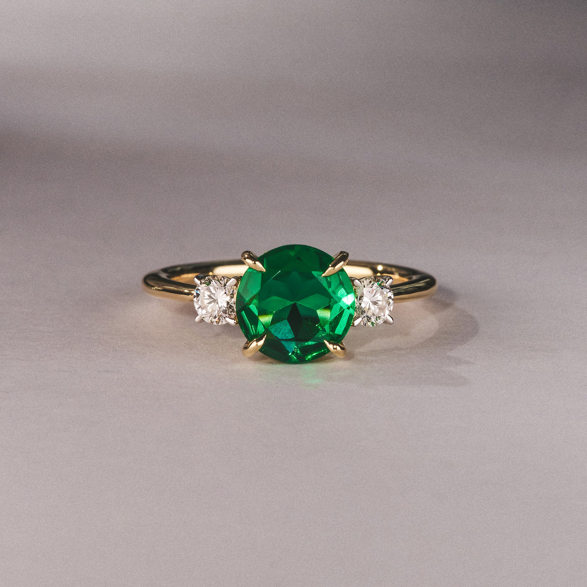 Solene 2.00ct Round Cut Lab Emerald and Lab Diamond 3 Stone Engagement Ring in 18K Yellow Gold
