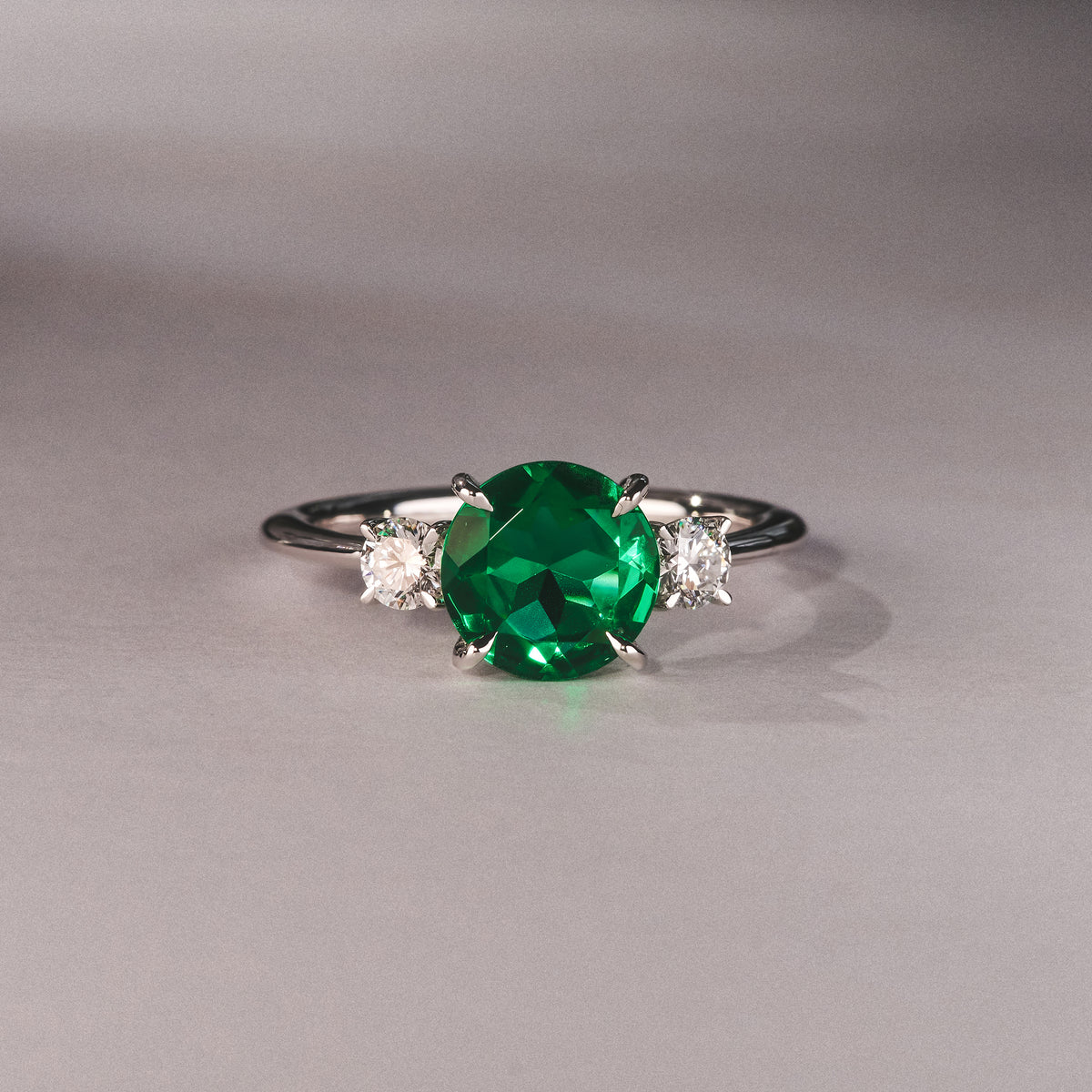 Solene 2.00ct Round Cut Lab Emerald and Lab Diamond 3 Stone Engagement Ring in 18K White Gold