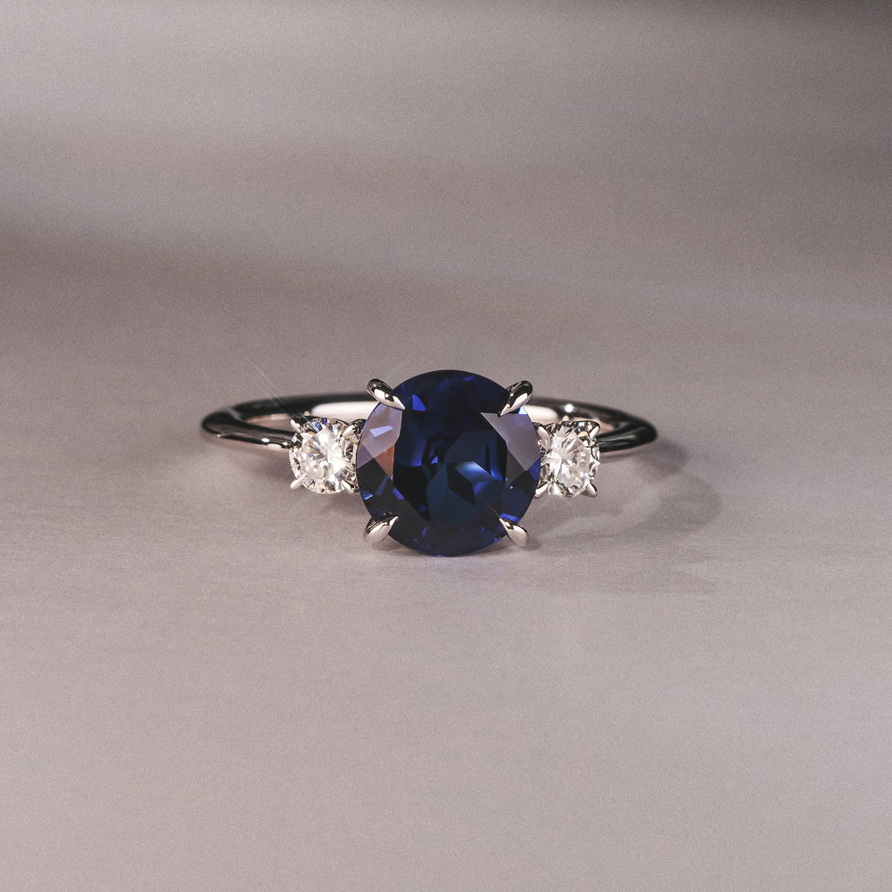 Solene 2.00ct Round Cut Lab Sapphire and Lab Diamond 3 Stone Engagement Ring in 18K White Gold
