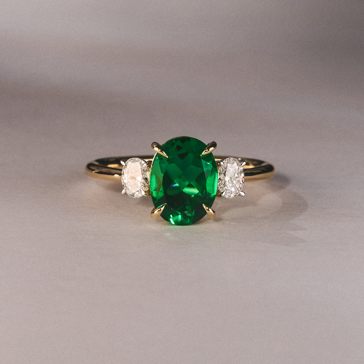 Solene 2.00ct Oval Lab Emerald and Lab Diamond 3 Stone Engagement Ring in 18K Yellow Gold